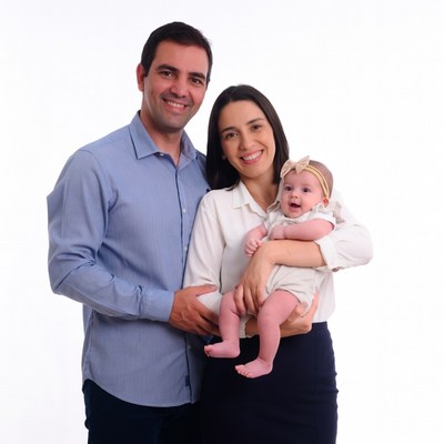 Smiling family with baby on white background