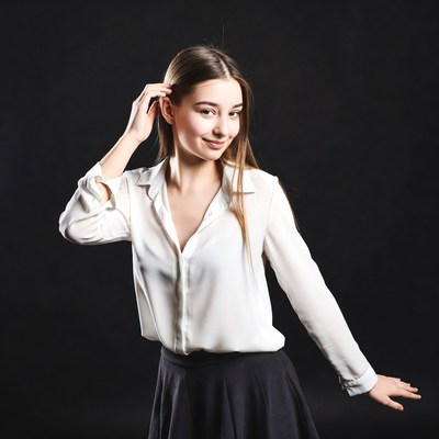 Young woman touching hair smiling