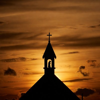 Silhouette church steeple at sunset