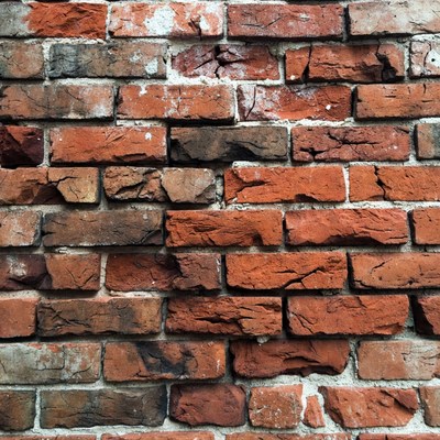 Old weathered red brick wall