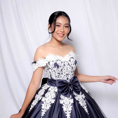 Asian woman in lace navy gown