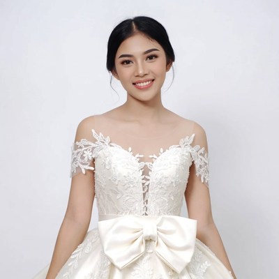 Asian woman in lace wedding gown