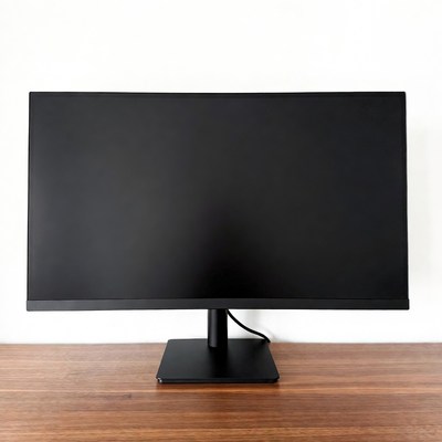 Black curved monitor on wooden desk