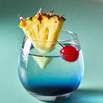 Pineapple Garnish on Blue Cocktail
