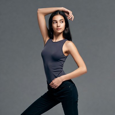 Young Asian woman posing in tank top