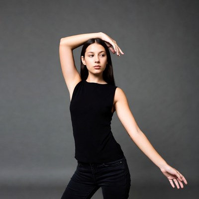 Young woman posing with hand on head
