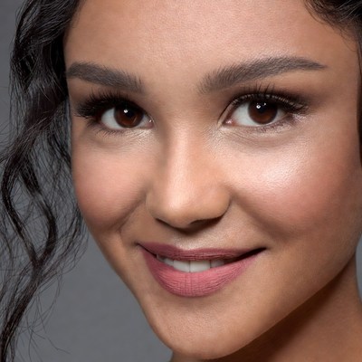 Beautiful woman with curly hair smiling