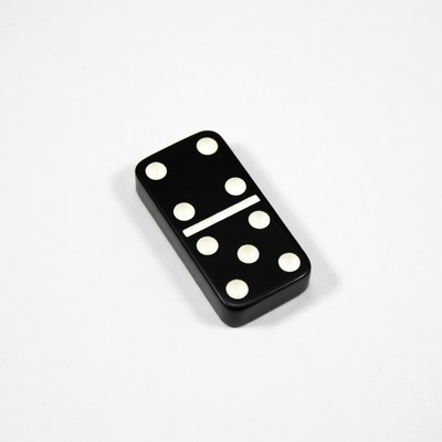 Black domino tile with six dots