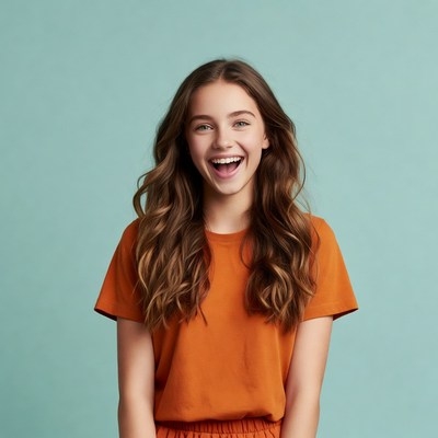 Teen girl smiling on blue background
