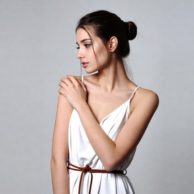 Woman in white dress profile view