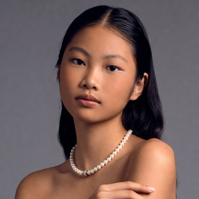 Asian woman with pearl necklace