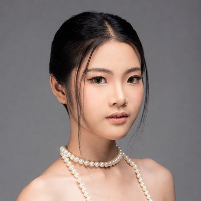 Asian woman with pearl necklace