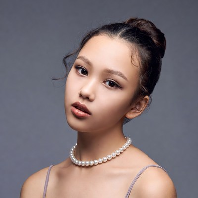 Asian girl with pearl necklace