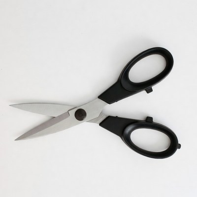 Black-handled scissors on white background