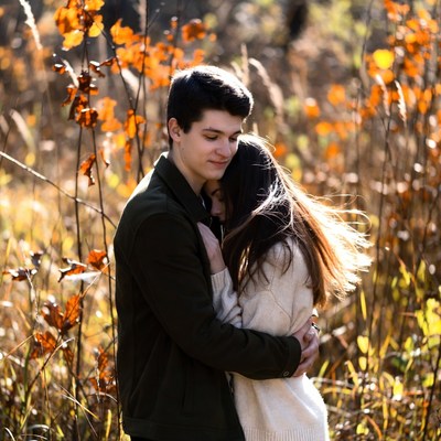 Young couple embracing in autumn field