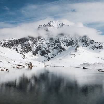 Snowy Mountain Reflecting in Lake