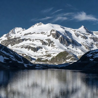 Snowy Mountains Reflecting in Lake