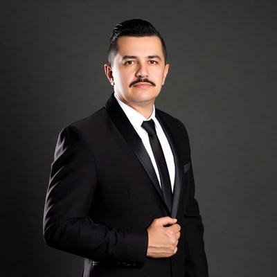 Latino man in black tuxedo suit