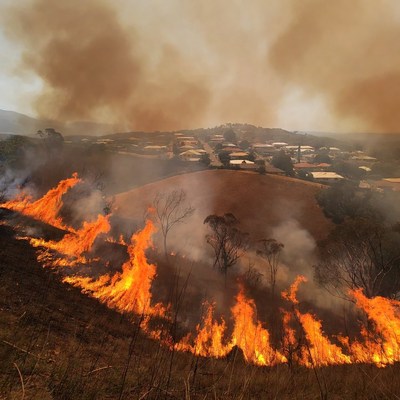 Bushfire engulfing hillside suburb