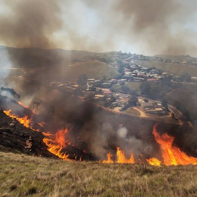 Wildfire engulfing hillside village