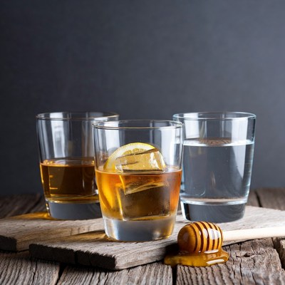 Whiskey with Lemon, Honey on Wood