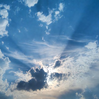 Bright sun shining through clouds