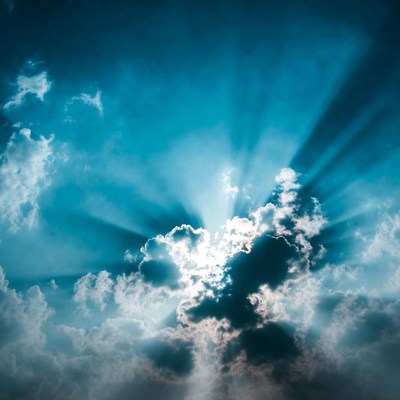 Sun rays beaming through clouds