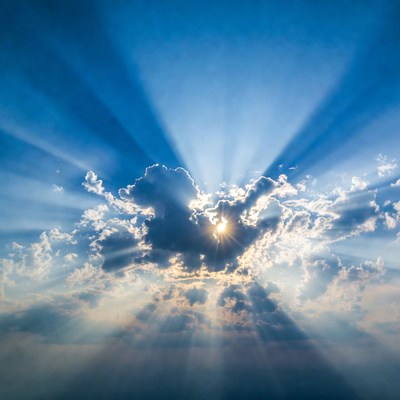 Sun rays bursting through clouds