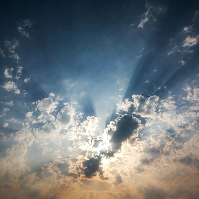 Sun rays piercing through clouds