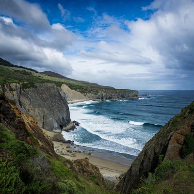 Ocean Beach with Cliffs and Waves