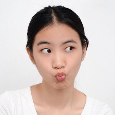 Asian girl making duck face pout