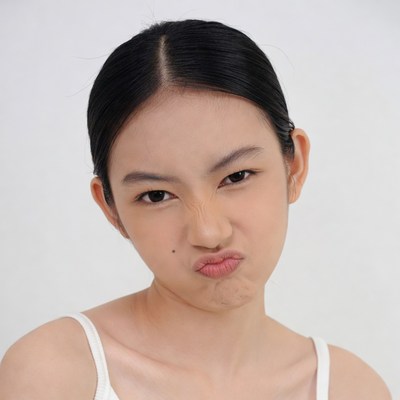 Asian girl making pouty face