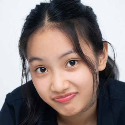 Asian girl with ponytail pouting