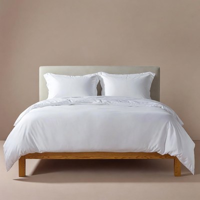 White Bedding on Wooden Bed Frame
