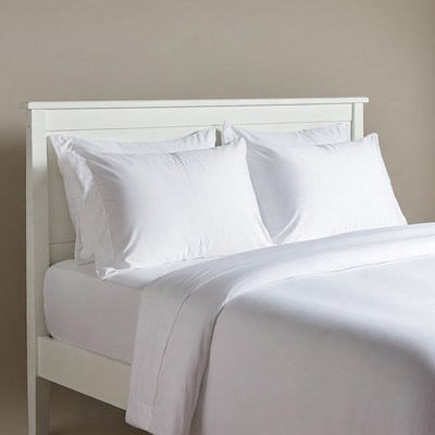 White Bed with Pillows