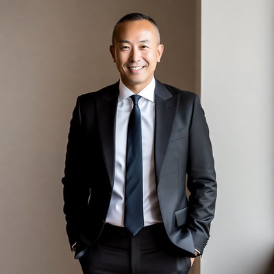 Asian man in suit smiling
