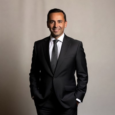 Smiling man in black suit