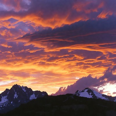 Dramatic Sunset Over Snowy Mountains