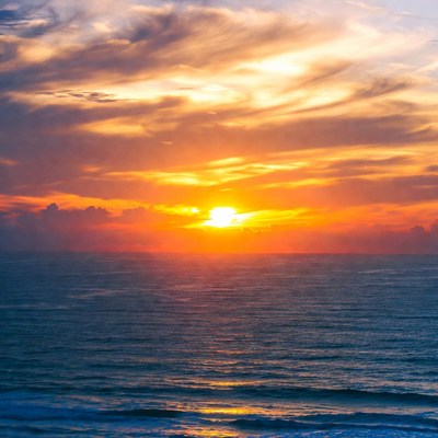 Sunset over ocean waves