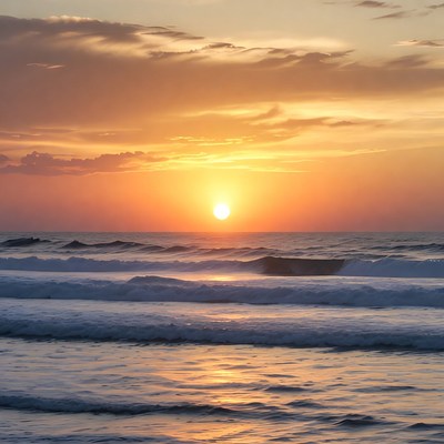Sunset over ocean waves