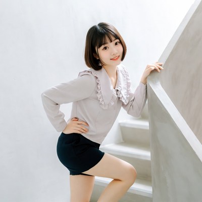 Asian woman posing on stairs