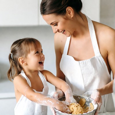Mother and daughter baking cookies
