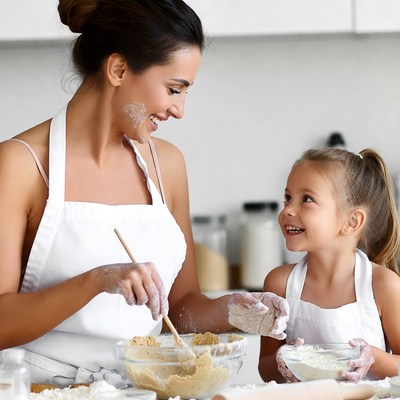 Mother and daughter baking together