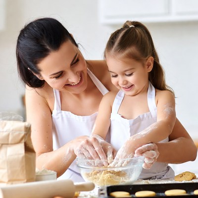 Mother and daughter baking cookies
