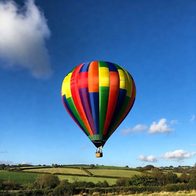 Colorful hot air balloon over fields
