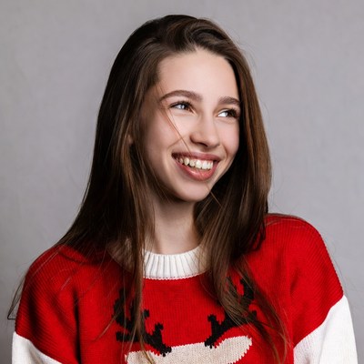 Smiling woman in reindeer Christmas sweater