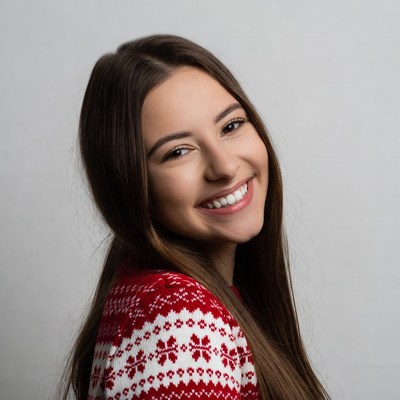 Smiling woman in red Christmas sweater