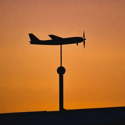 Airplane Silhouette Weather Vane at Sunset