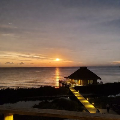 Overwater bungalow at sunset beach