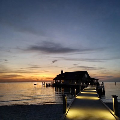 House on pier at sunset